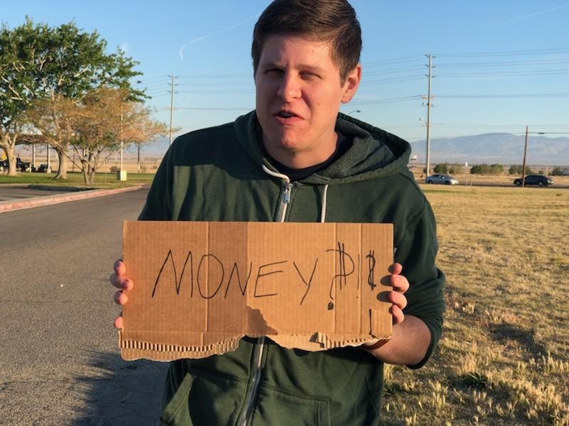 Casey begs for money.